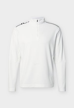 Valkoinen pitkähihaisen poolopaita, jossa on neljänneksen mittainen vetoketju ja mustat reunukset olkapäillä, yksinkertaisella taustalla.