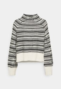 Pull en maille à manches longues avec motif noir et blanc, col montant, poignets et ourlet côtelés sur fond uni.