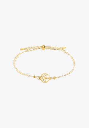 Bransoletka w złotym odcieniu z plecionym żółtym sznurkiem. Posiada okrągły medalion z motywem drzewa na środku oraz zapięcie na suwak.