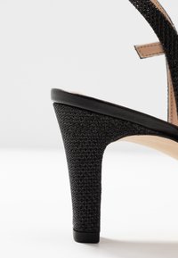 Unisa Korolliset sandaalit - black