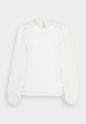 Fehér kötött blúz kerek nyakkivágással, ballon szabású ujjal és csipkés részletekkel a vállakon. Puha, texturált anyag, laza szabással.