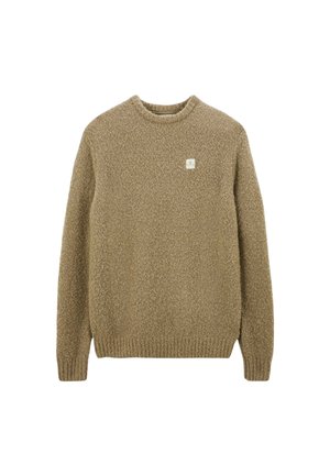 Pull en tricot beige en tissu texturé avec un col rond et des poignets côtelés. Présente une petite étiquette logo à l'avant.
