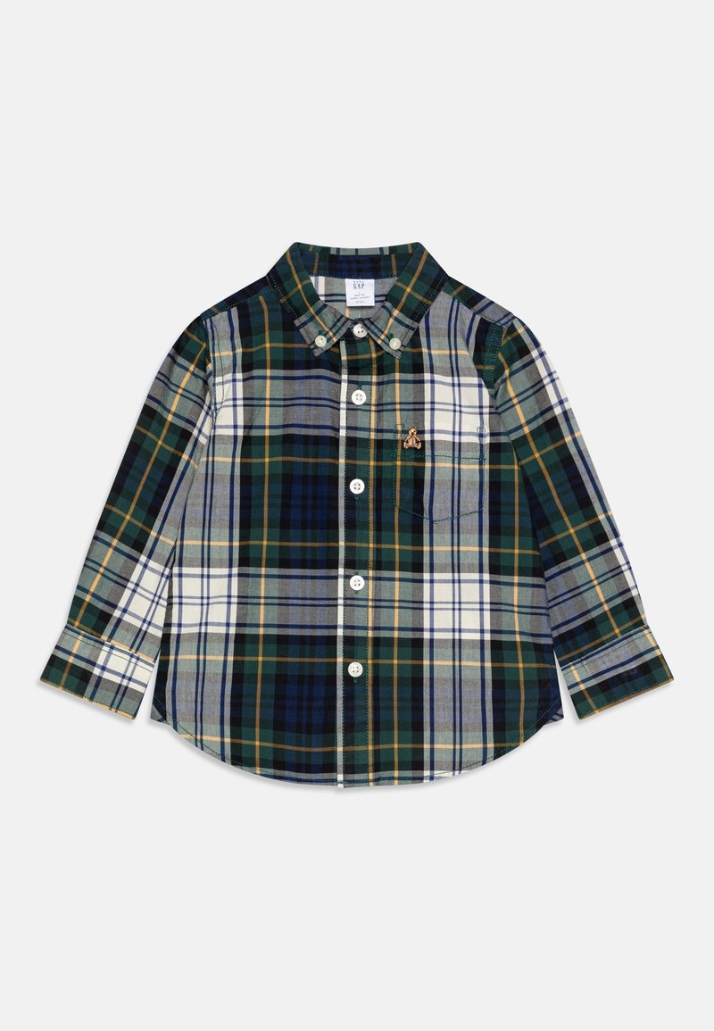 Chemise enfant à manches longues boutonnée avec motif à carreaux verts, bleu marine, blanc et jaune et petit ours brodé sur la poche poitrine.