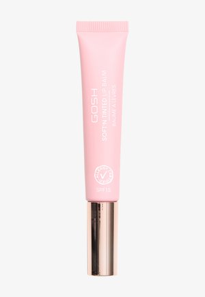 Balsam do ust GOSH Soft'n Tinted w różowej tubie z metaliczną, złotą podstawą; posiada biały tekst i etykietę SPF 15, zaprojektowany z myślą o łatwej aplikacji.