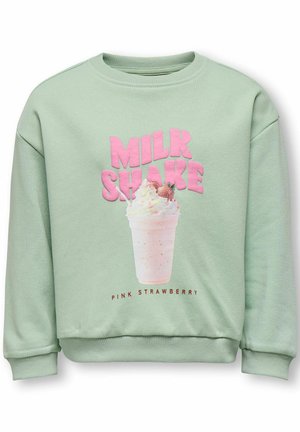 Light green sweatshirt with pink "MILK SHAKE" text and a whipped cream strawberry milkshake graphic labeled "PINK STRAWBERRY" on front.