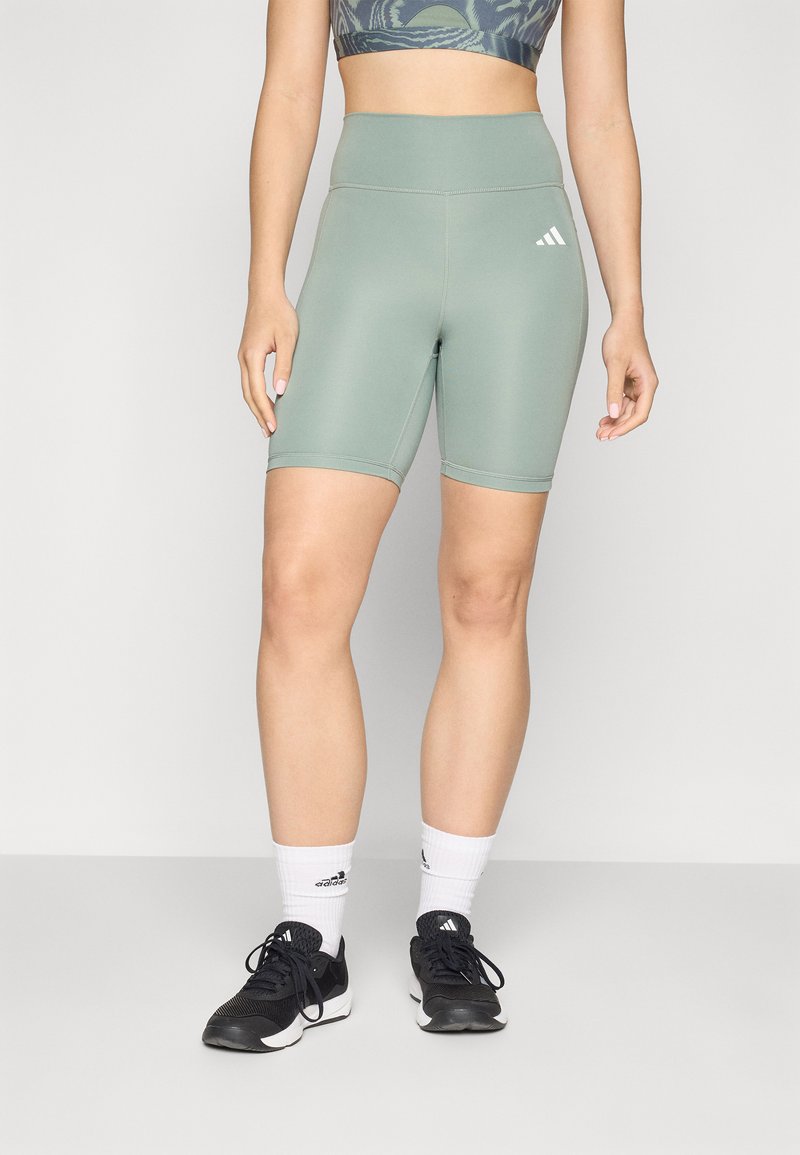 Lysegrøn højtaljede cykelshorts lavet af strækstof, med elastisk talje og kontrasterende hvidt logo på venstre ben.