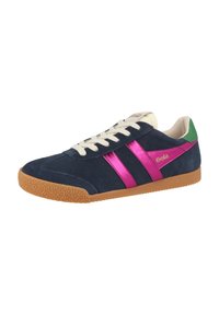 Navy blue suede sneaker with pink leather stripes, cream laces, and a green heel tab. Features a textured gum rubber sole.