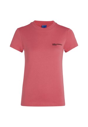 T-shirt en coton rose à manches courtes. Présente un col rond et un petit logo noir sur le côté gauche de la poitrine. Texture lisse.