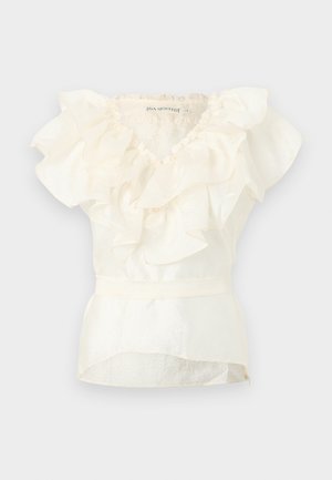 Witte mouwloze blouse met gelaagde ruches details op de halslijn en een aangesloten taille.