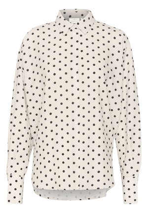 Camicia a maniche lunghe in tessuto crema chiaro con grandi pois neri, dotata di colletto con bottoni e chiusura frontale con bottoni.