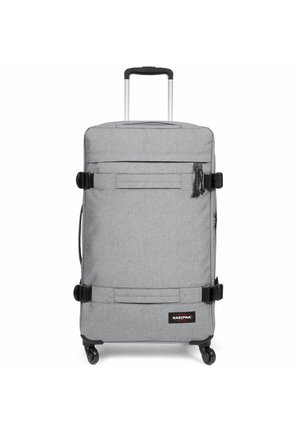 Gray wheeled suitcase with a rectangular design, fabric texture, two front straps, a top handle, and a retractable handle.