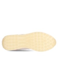 Sko sula med en slät, ljusbrun gummiyta som har ett prickigt mönster för bra grepp. Rundad tådesign med en lätt uppåtböjning.