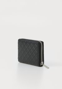 Black leather wallet with embossed diamond pattern, silver zipper, and pull tab, standing upright on a white surface.