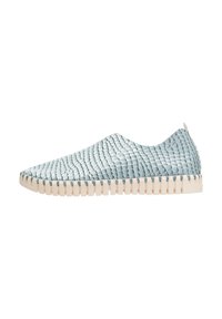 Light blue woven slip-on shoe with a textured surface, featuring a beige rubber sole and a minimalist design.