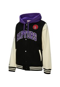 Schwarze und weiße Vigorjacke mit lila Kapuze, auf der "RAPTORS"-Aufschrift und ein Logo-Patch zu sehen sind, sowie gerippte Bündchen und vordere Druckknöpfe.