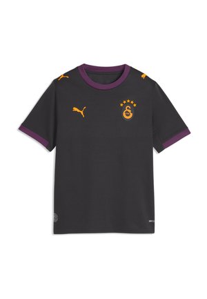 Sort kortærmet sportstrøje med lilla krave og manchetter, gule Puma-logoer og et gult emblem med fem stjerner på brystet.
