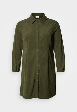 Olive green corduroy shirt dress with a button-down front, classic collar, and long puff sleeves. Textured fabric with vertical ribbing.