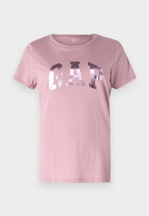 Rosa Baumwoll-T-Shirt mit kurzen Ärmeln, runder Ausschnitt und metallischem GAP-Logo auf der Brust. Weiche Textur, lässige Passform.