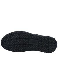 Schwarze Schuhsohle mit einem strukturierten Muster, das Rillen für besseren Halt aufweist. Das Material wirkt gummiartig mit einer soliden Oberfläche und einem zentralen Logo-Bereich.