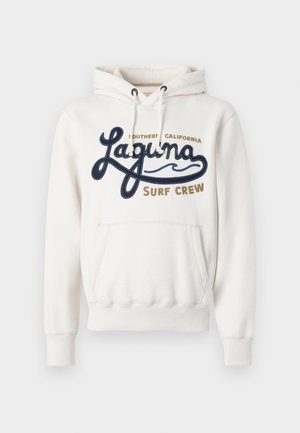 Cream hoodie with a front pocket, featuring "Laguna Surf Crew" in navy and brown embroidery. Adjustable drawstring on the hood.