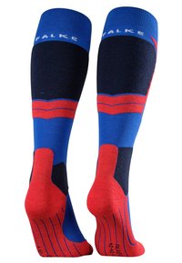 Calze al ginocchio in blu, rosso e nero. Presentano un bordo a costine, motivi a colori contrastanti e suole imbottite con grip testurizzati.