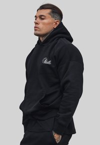 ESSENTIALS  - Hoodie - black