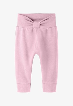 Pehmeät vaaleanpunaiset vauvan housut, joissa on korkea vyötärönauha, keskellä kangassolmulla koristeltu ja nilkoissa resorit.