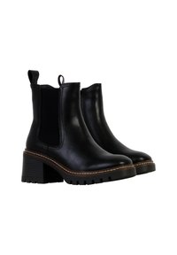 Bottines noires en cuir avec des panneaux latéraux élastiques, une languette et un talon épais. Elles présentent une semelle texturée et des accents de couture visibles.