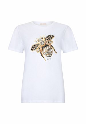 Camiseta blanca de manga corta con un gran diseño de abeja con joyas en dorado, negro y cristales transparentes en el pecho, con el texto "LIU JO" debajo.