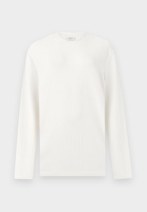 Maglia bianca a maniche lunghe in tessuto waffle con scollo rotondo e orlo dritto, con etichetta all'interno del colletto.