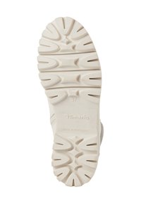 White sneaker outsole with textured rubber, featuring a pronounced tread pattern and the brand name "Tamaris" embossed. Size 37 marked.
