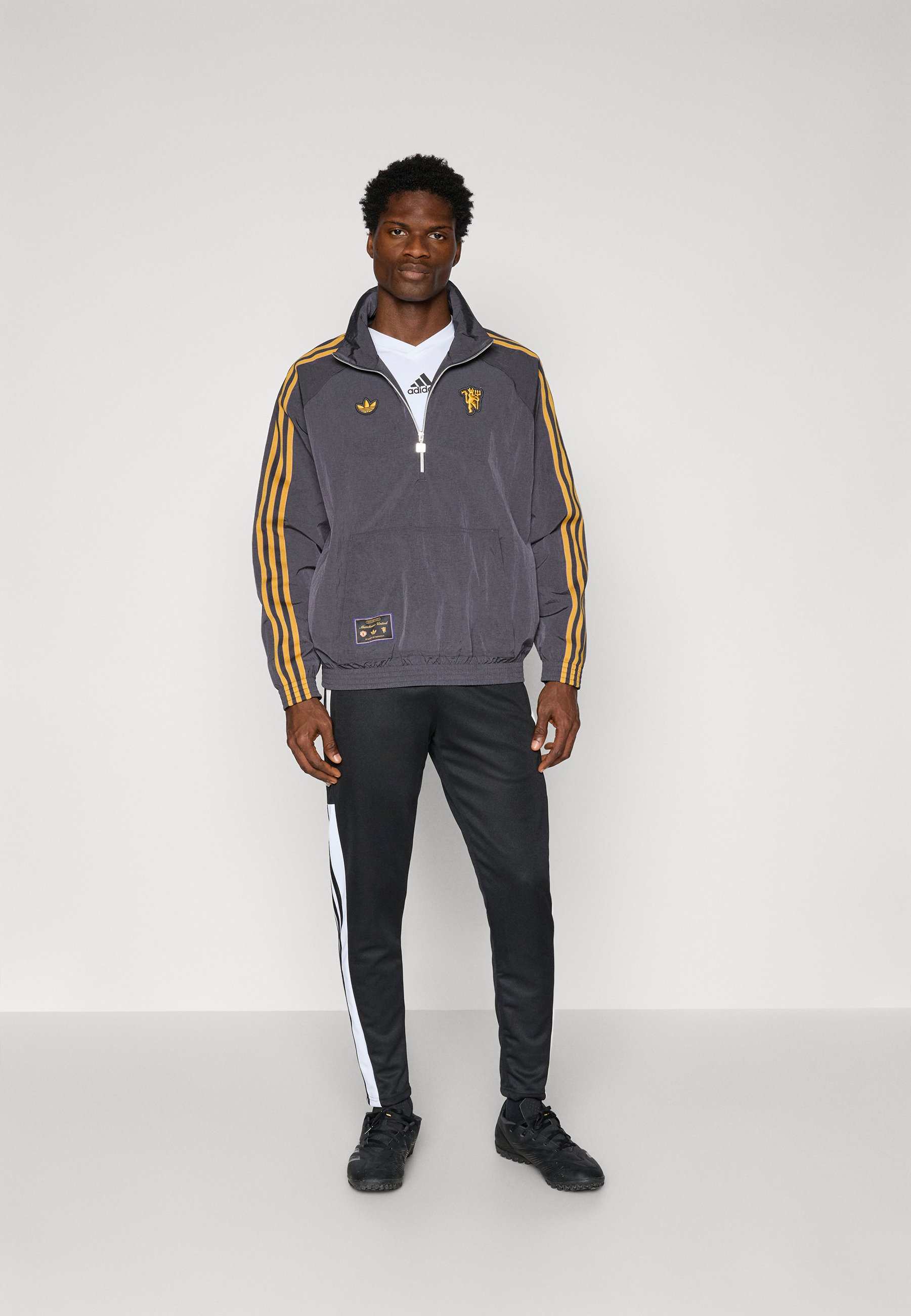 adidas Manchester United セットアップ ナイロン上下 黒 adidas Originals Manchester United 24/25 Terrace Icon Track
