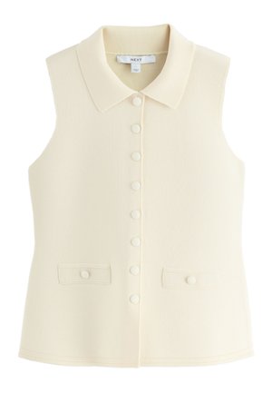 Mouwloos crème knoopspeld met kraag en twee klepzakken aan de voorkant, gemaakt van gestructureerde stof.