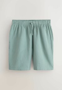 Shorts décontractés bleu clair avec taille élastique et cordon, tissu texturé, style longueur genou.