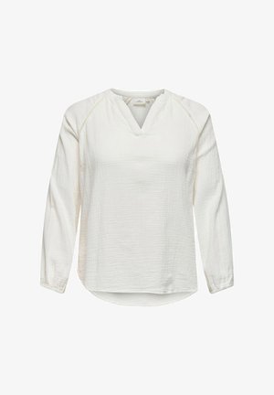 Balta, garām piedurknēm blūze ar V-veida kaklu un teksturētu audumu. Iespējas ar smalku apdari pie pleciem un noapaļotu apakšmalu.