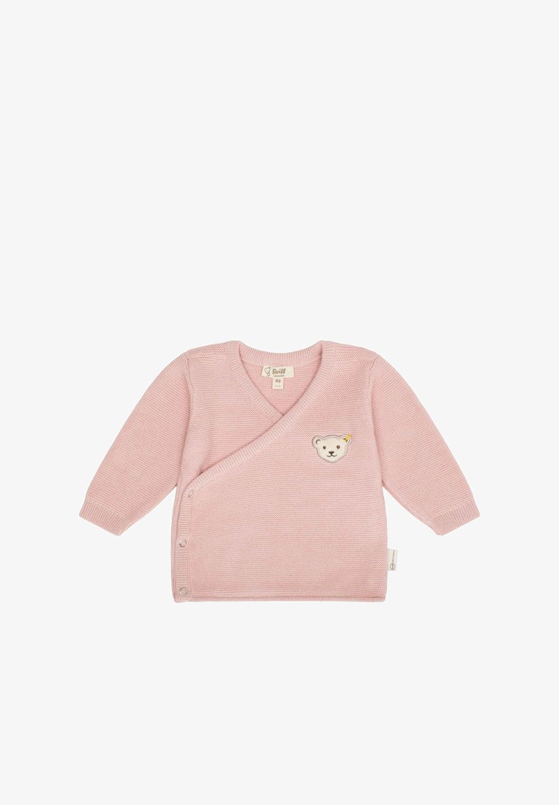 Růžový pletený cardigan s výstřihem do V a dlouhými rukávy, se zvláštním motivem medvídka a zapínáním na knoflík na boku. Hladká textura.