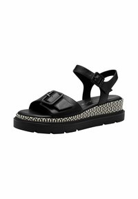 Sandali platform in pelle nera con una larga fascia con fibbia e una suola testurizzata con motivo geometrico. Inclusa una fascia regolabile per la caviglia.