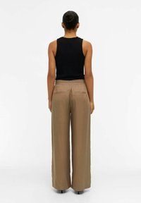 Object OBJTILDA TALULA LONG NOOS - Housut - fossil