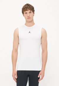 White sleeveless athletic shirt made of smooth fabric, featuring a round neckline and a black Jordan logo on the chest.