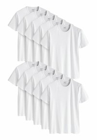 Witte katoenen T-shirts met korte mouwen, ronde halsontwerp en een eenvoudige textuur, gerangschikt in een stapel, met meerdere identieke artikelen.