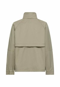 Veste longue beige clair à manches longues avec col montant, soufflet dans le dos et poignets élastiques, vue de dos sur fond blanc.