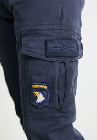 Alpha Industries PETROL PATCH - Cargo trousers - ultra navy