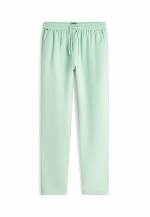 Pantalones casuales verde claro con cintura elástica, cordón ajustable y bolsillos laterales, extendidos sobre un fondo blanco.