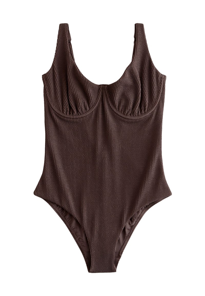 Maillot de bain une pièce marron côtelé avec bretelles larges, détail froncé au niveau de la poitrine et découpes hautes aux jambes. Texture douce et coupe ajustée.