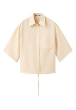Beżowa, oversizeowa koszula z krótkim rękawem, zapinana na guziki, z kołnierzykiem, kieszenią na piersi oraz ozdobnym sznurkiem wiszącym przy dole.