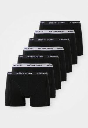 Crne bokserice pakirane u sedam komada, s bijelim elastičnim pojasom na kojem je logo "BJÖRN BORG". Glatka tkanina, standardni kroj, bez uzoraka.