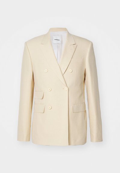 Dubbellaags blazer in lichtbeige linnen, met vier voorzakken en ronde knopen. Schone lijnen en een op maat gemaakte uitstraling.