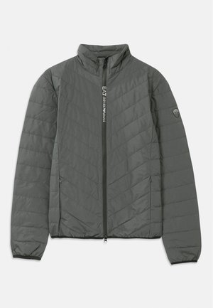 Dark gray quilted jacket with stand-up collar, front zipper featuring "EA7 Emporio Armani" text, zippered side pockets, and logo patch on the sleeve.