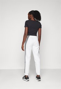 adidas Sportswear Donji dijelovi trenirke - white