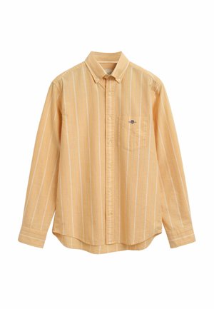 Camicia button-up gialla chiara con righe verticali bianche, taschino sul petto e colletto a punta. Realizzata in tessuto traspirante.